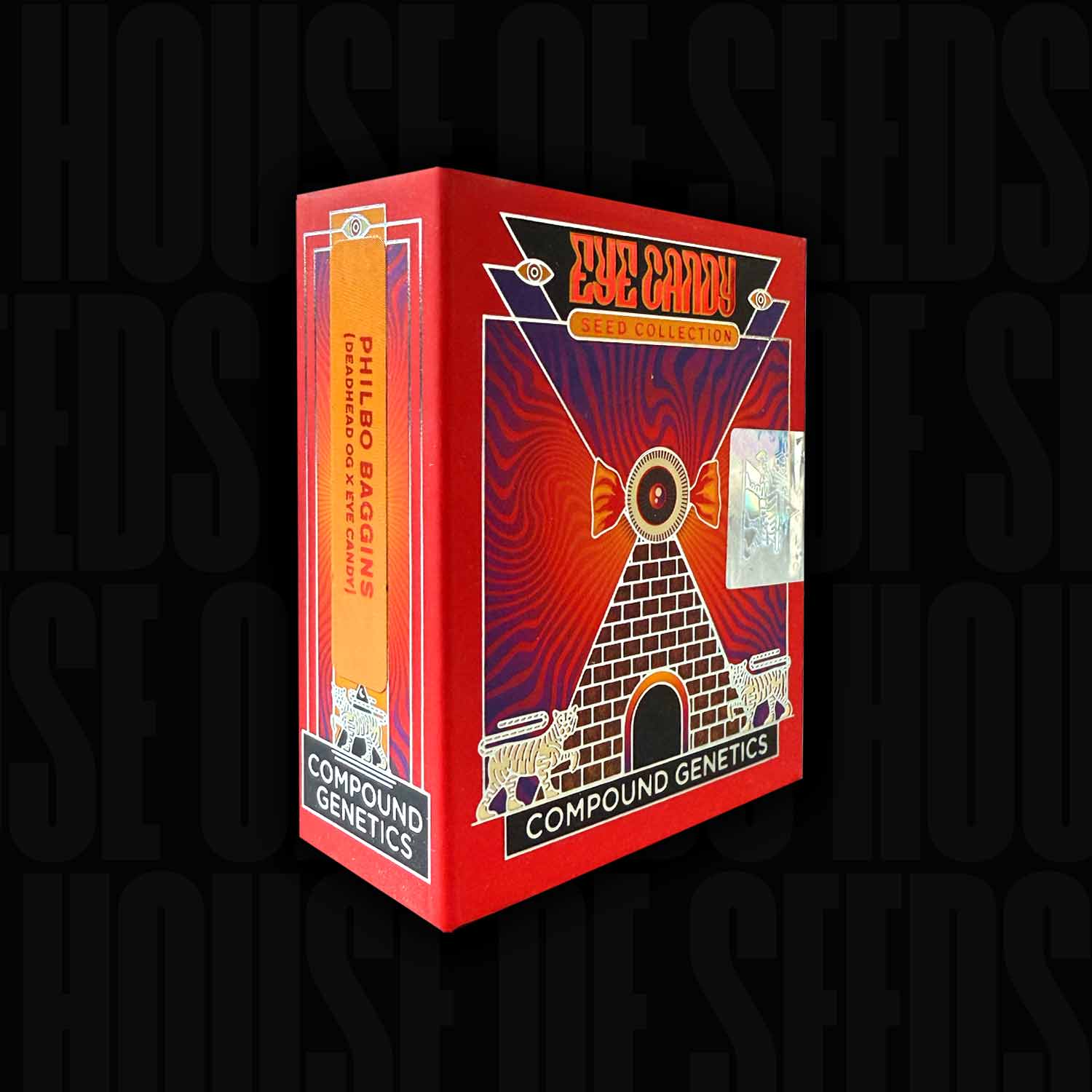 Philbo Baggins Saatgutkiste mit geometrischem Pyramidendesign und Compound Genetics Etikett auf dem Boden.